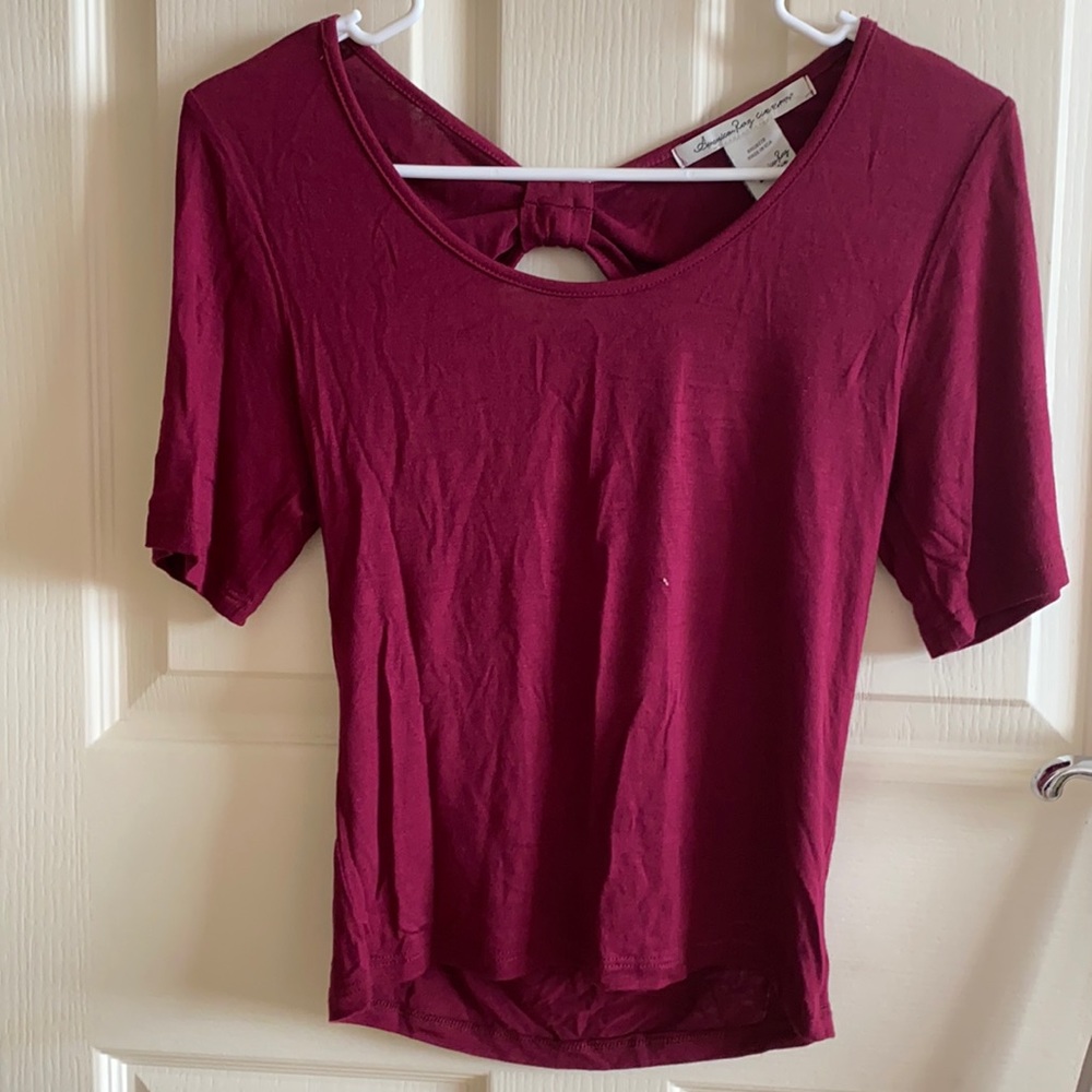 American rag women’s size small short sleeve top in burgundy with cut out back